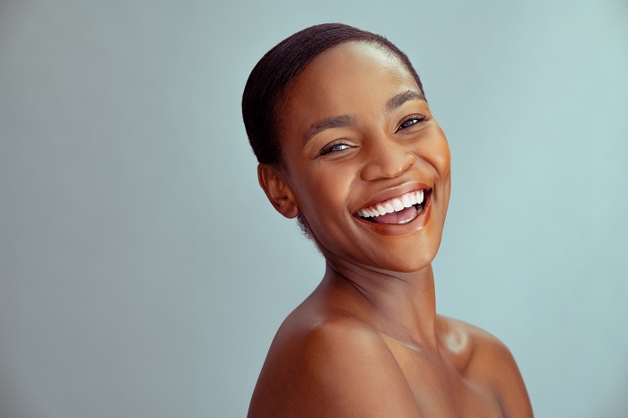 Cheerful black woman with healthy skin