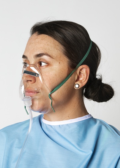 Female patient wearing oxygen mask