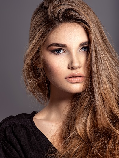 Pretty faced fashion model woman with brown hair