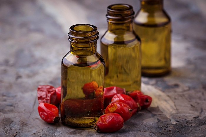 Rosehip essential oil in small bottles