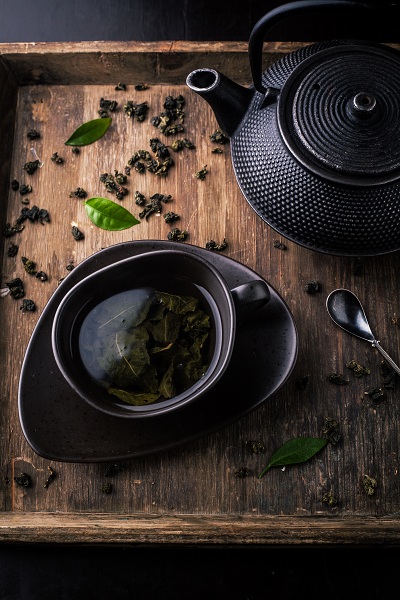 Teapot and cup with green tea