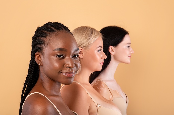 Three women of different race and skin types