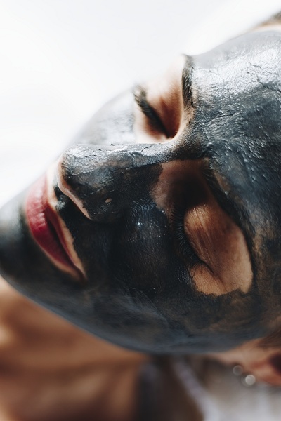 Woman on charcoal face mask