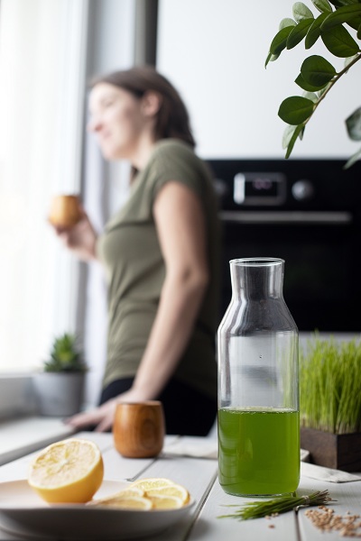 Woman taking antioxidant juices before starting her day