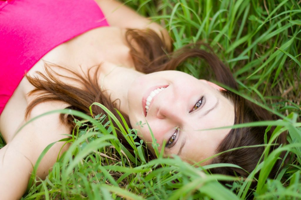 Pretty woman laying on the grass