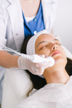 Woman getting facial treatment
